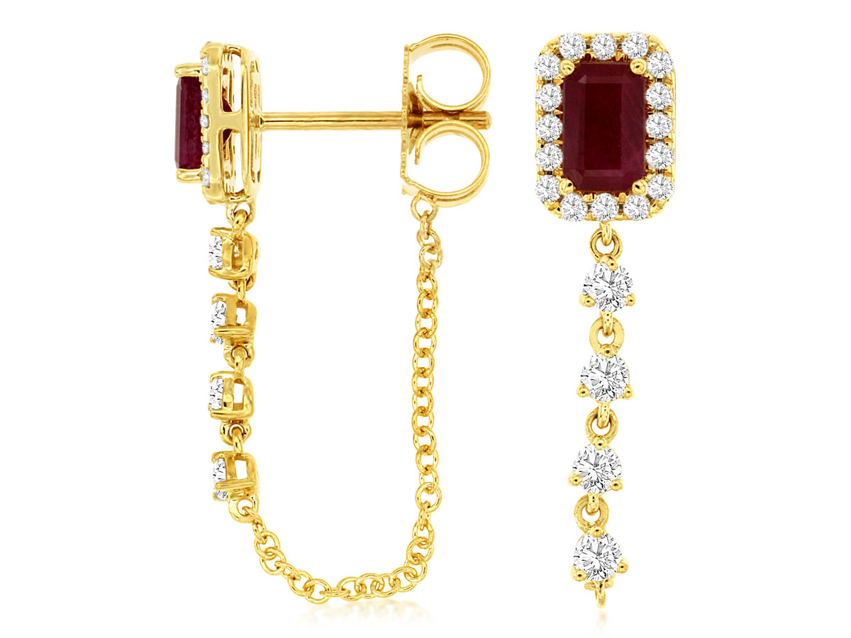 Gold earrings with ruby center, diamond halo, and dangling chain. Elegant jewelry design, luxury fashion accessory.